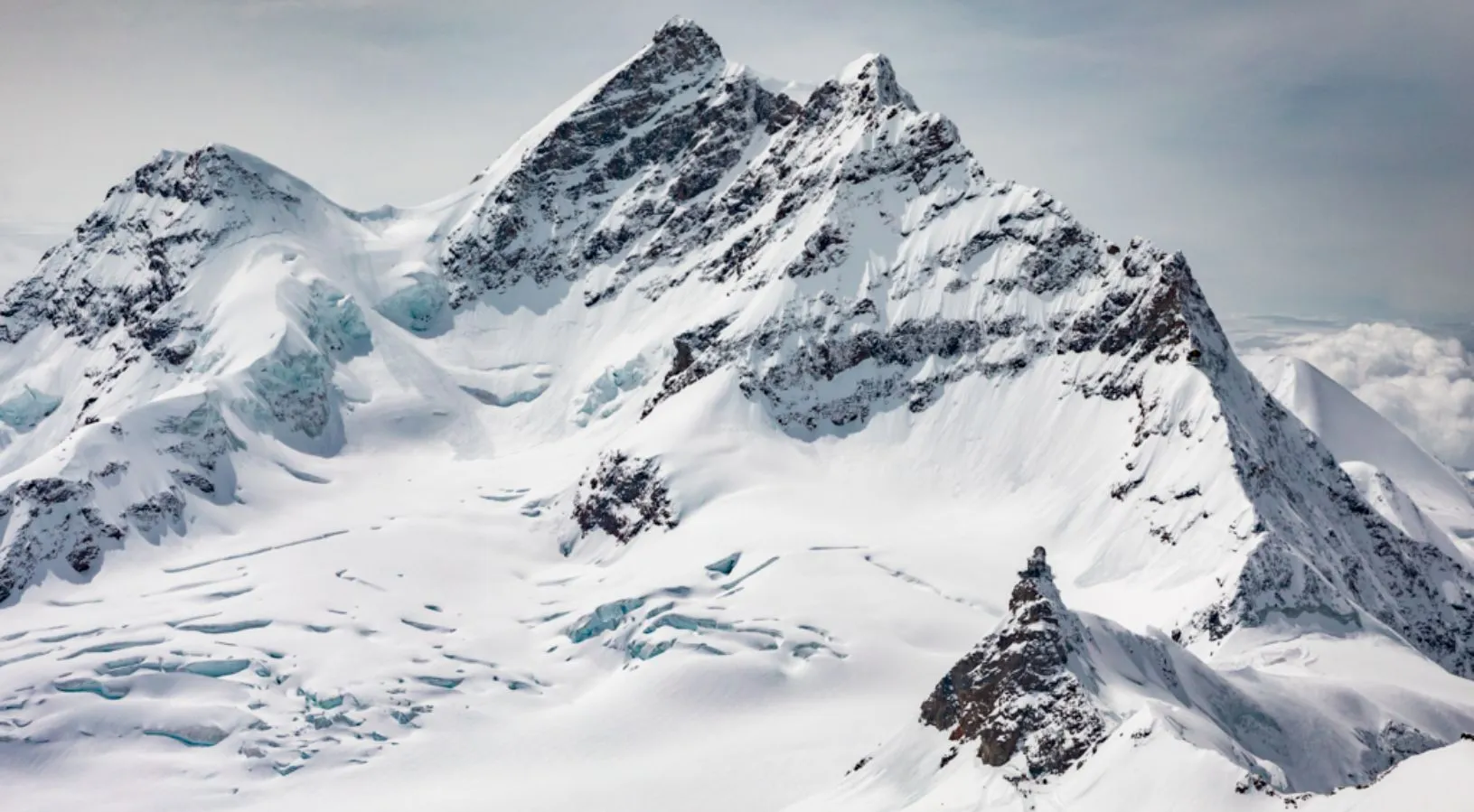 Snowy peak of Jungfraujoch - Experiencing the Mountains of Switzerland should be on your bucket list