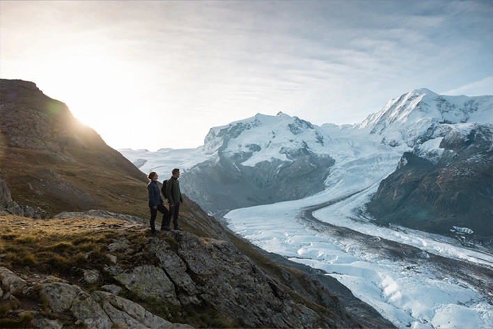 Two people staring at glaciers in Zermatt.