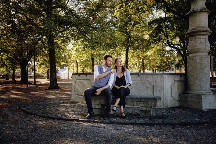 Man and women relaxing at a park in Zurich