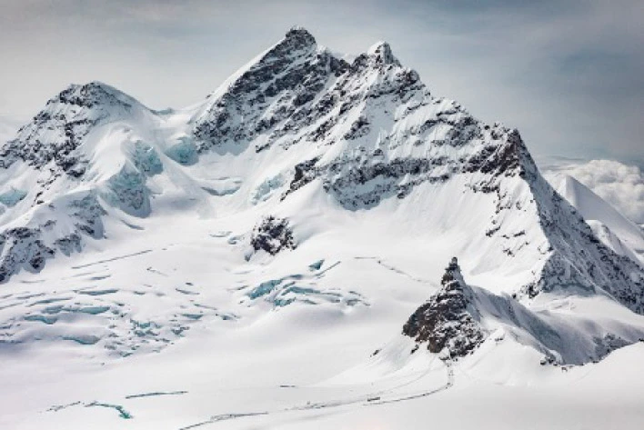 Jungfraujoch, top of Europe, snowy mountain with a trail