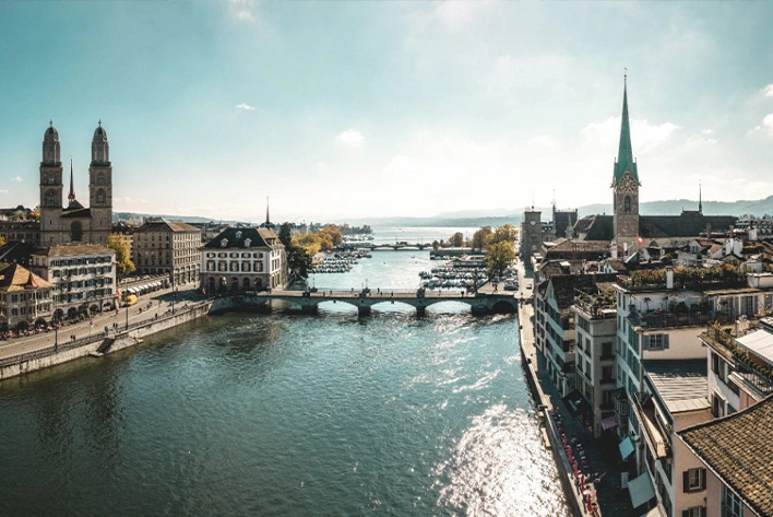 View of Lake Zurich, Switzerland with a bridge and buildings