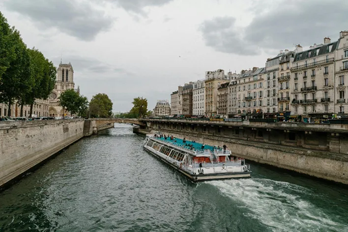 Scenic view of a ferry on the Seine, showcasing the beauty of Paris