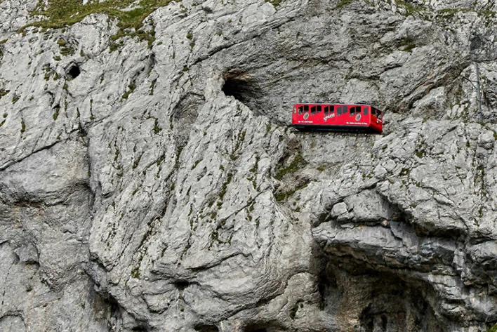 The iconic Pilatus Railway navigating the rugged slopes of Mount Pilatus in Switzerland.